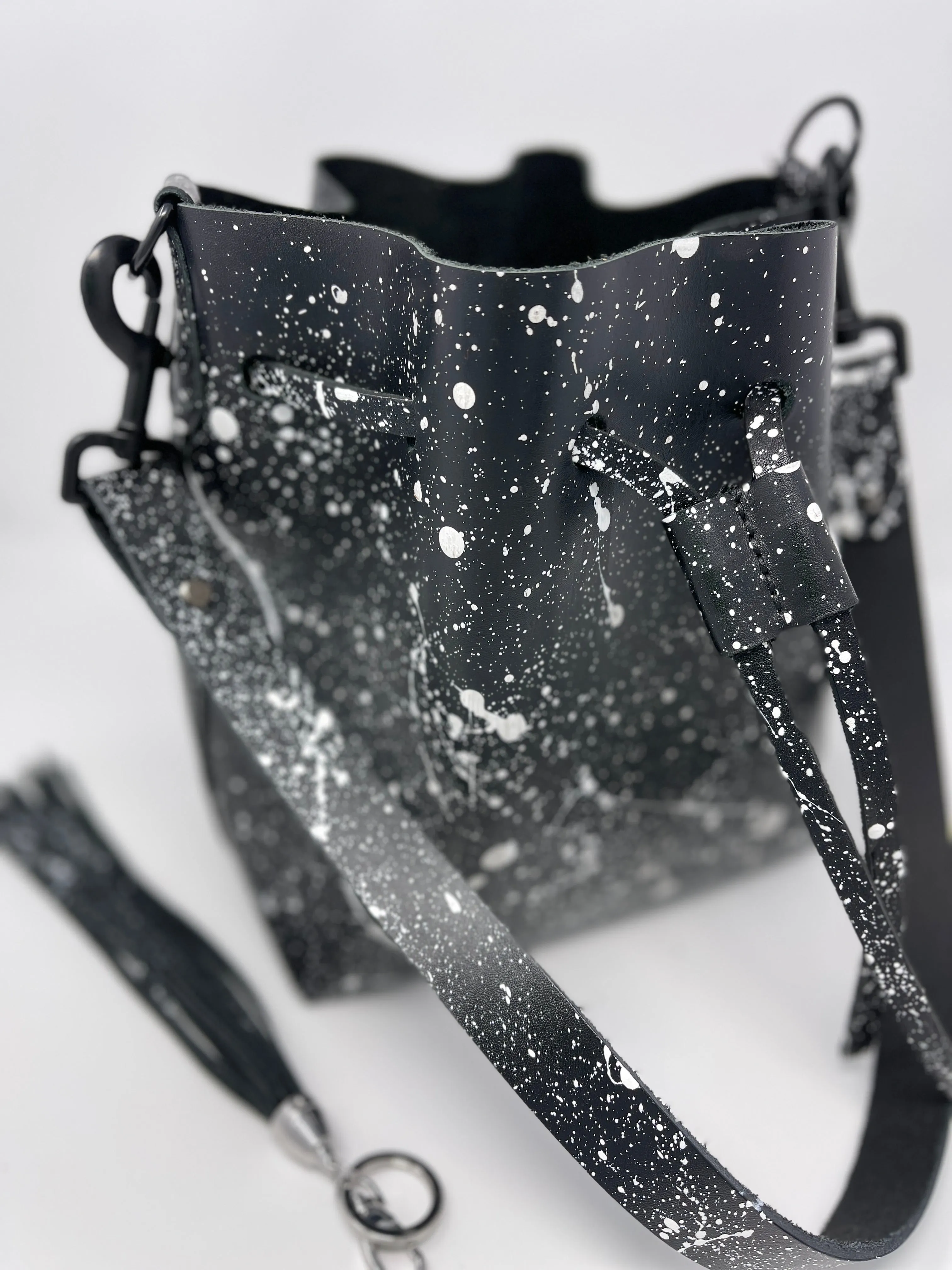 Black Leather Drawstring Bucket Shoulder Bag With Matte White Splatter